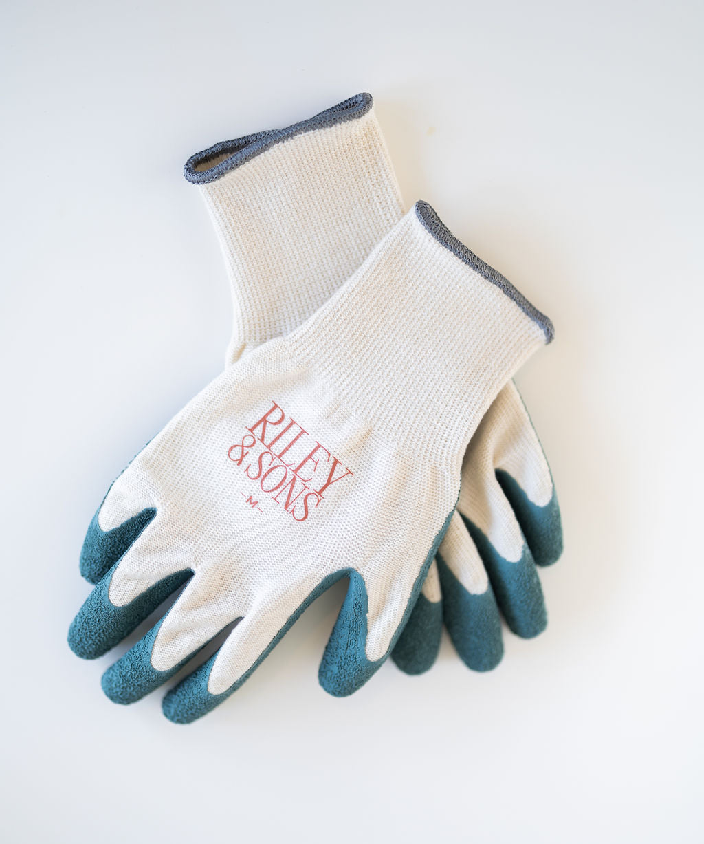Pair of garden gloves with organic cotton and natural rubber on a plain white background.