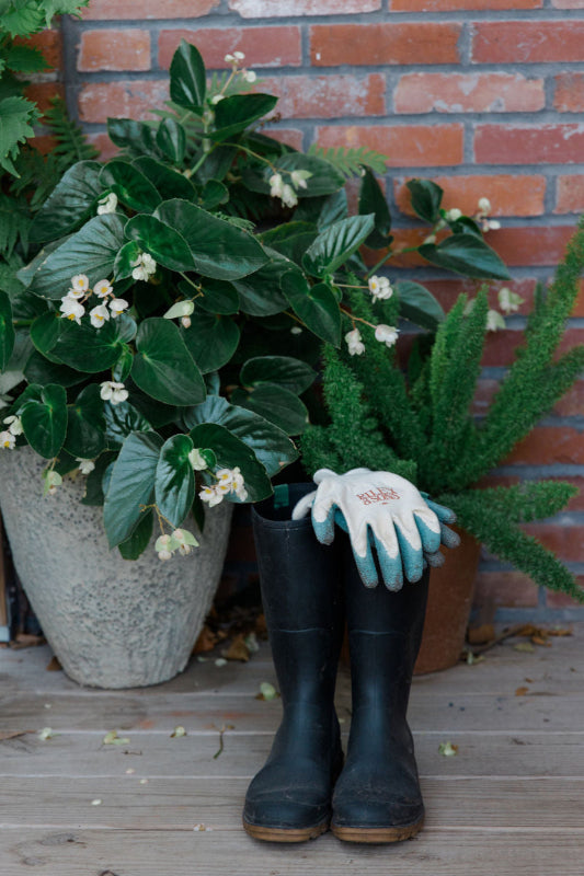 Riley & Sons Garden Gloves on top of garden boots.