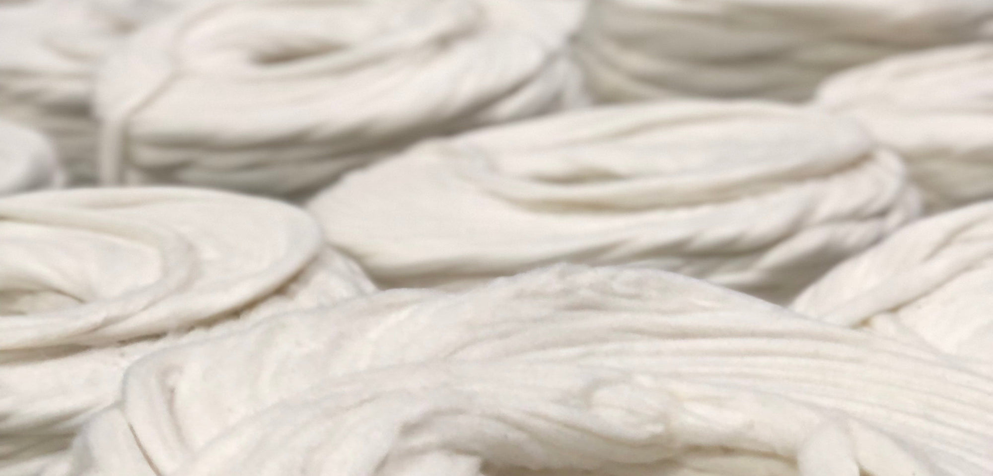 Close-up of white cotton spun into yarn